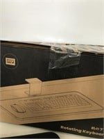 Rotating keyboard tray under desk
