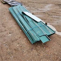 Pile of 11' Used green roofing steel