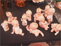 11 bisque kewpie doll figurines, from 2" to 4"