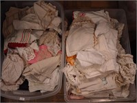 Two containers of vintage linens including