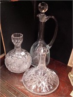 Three pressed and etched glass decanters