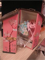 Pink doll trunk in form of a house with Madame