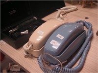 Two Princess-style desk phones, one blue and