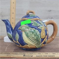 Blue teapot with bird design