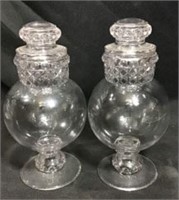 Two Glass Candy dishes measure 8 inches tall