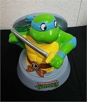 Ninja Turtle piggy bank has small chip in it