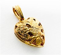 14k Hawaiian style heart pendant with bird 1.54g