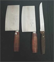 Three large knives one is Sheffield the other two