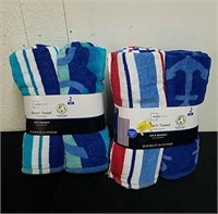 Two new two packs of beach towels