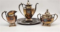 Victorian Pairpoint Silverplate Tea Service on an