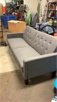 Gray upholstered sofa/collapsible