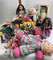 Large bin of dolls & doll clothes. Also includes