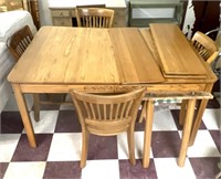 Dining room table w/3 extra leaves 4 chairs