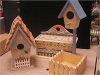 Two decorative birdhouses 14" and 10" tall,