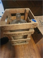 Sparkling Spring Mineral water old crate and jug