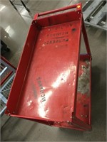 Red rolling metal cart. 34x16x31.