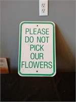 Please don't pick our flowers sign