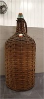 Wicker / Rattan Wrapped Glass Bottle, 21" Tall.