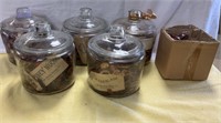 5 glass containers. removable lids with potpourri
