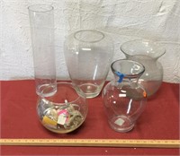 5 large glass containers in plastic tote