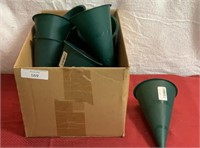 Big box of green plastic flower holders for the