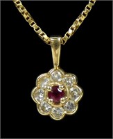 14K Yellow gold ruby and diamond flower pendant