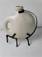 Contemporary ceramic vase on iron stand