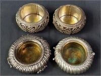 4 cast metal & brass candle holders made from