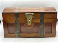 Vintage wooden locking treasure chest with brass
