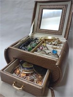 Small purse shaped jewelry box filled with