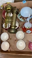 Mixed teacups and an oil sconce lamp attachment