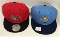 Two brand new baseball caps