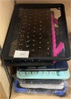 Stack of wireless keyboards and tablet cases