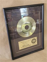 The Beatles Gold 45 Record Sales Award.