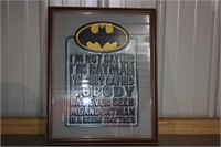 Batman metal sign framed under glass