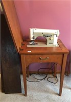 Necchi sewing machine in cabinet