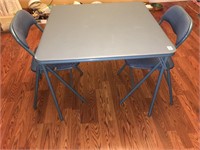 padded top card table and 2 chairs