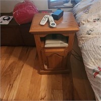 Small night stand with storage slot and door