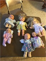 Misc dolls and clothes and blankets