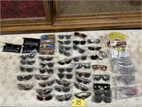 Assorted sunglasses, blue stoppers, safety