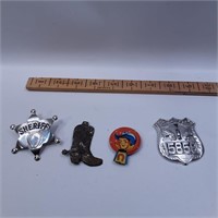 Vintage police shields, one metal boot