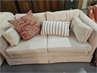 Modern love seat with pillows