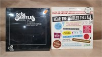 Beatles records sealed in plastic.