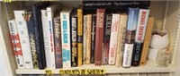 Shelf of Books to include John Grisham, Robert