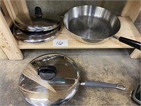 2 STAINLESS STEEL PANS W/ EXTRA LIDS