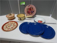 Enamelware plates, bowls and sauce pan and a tin