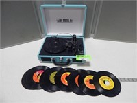 Victrola portable record player and some 45's