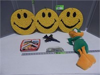 Toy plane, marbles, smiley face wall hangings, stu