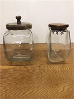 2 glass candy jars with wood lids