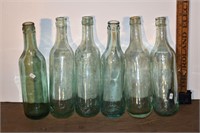 6 early unmarked bottles, 4 with round bottoms, 8.